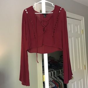 Red Long Sleeve top with Flared Sleeves.